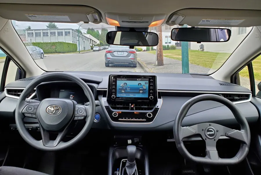Dual steering wheel setup showing instructor controls